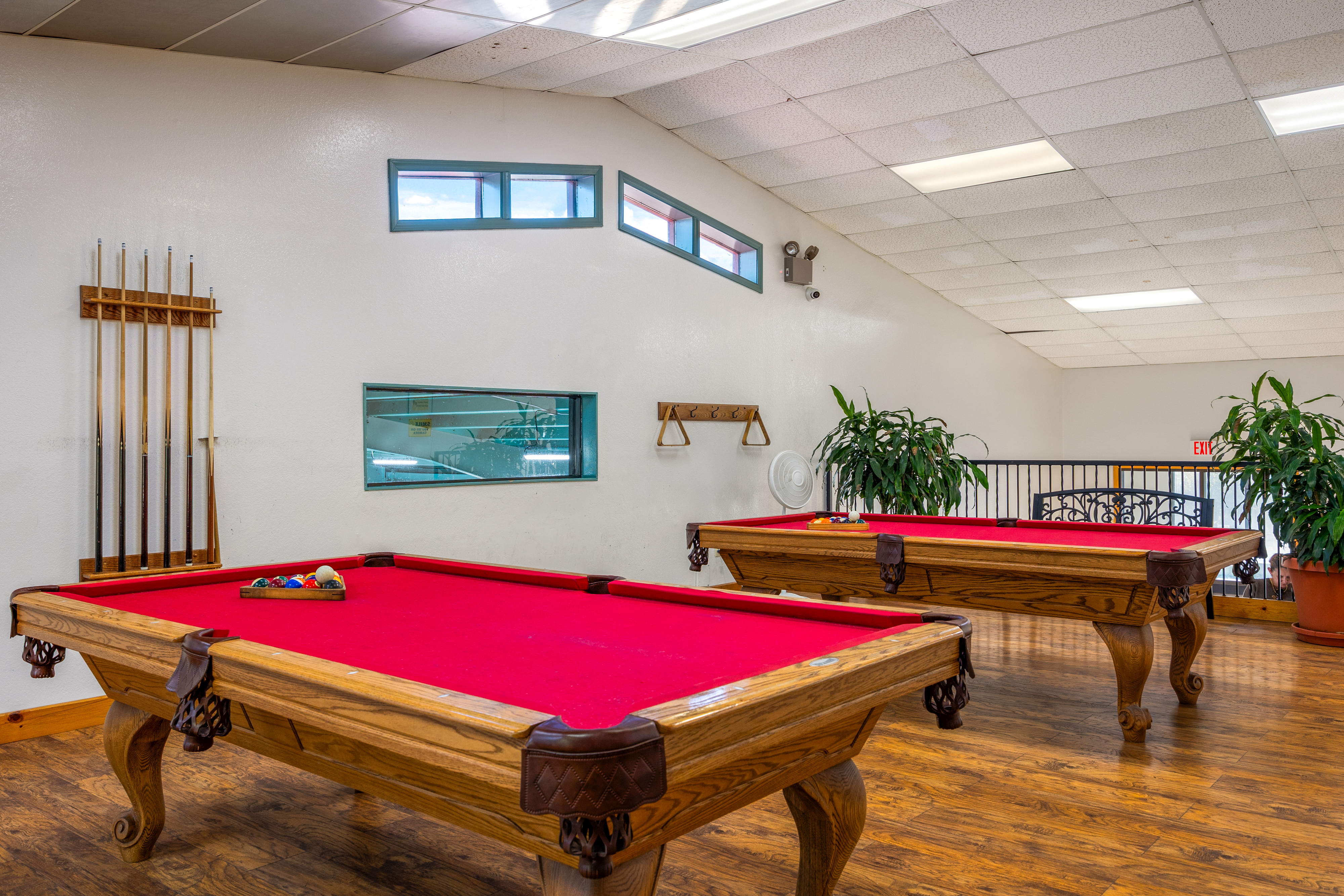 Billiards room with pool tables
